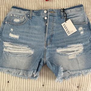 Button fly distressed shorts